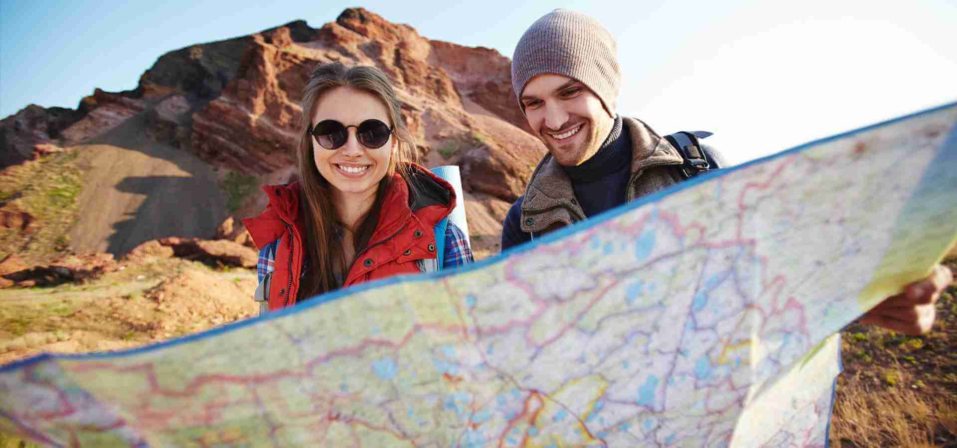 A couple of travellers who look forward to a happy journey